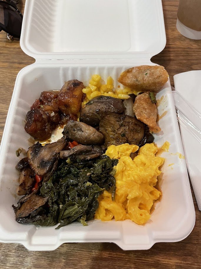 Grab-and-go lunch foods on stainless shelves